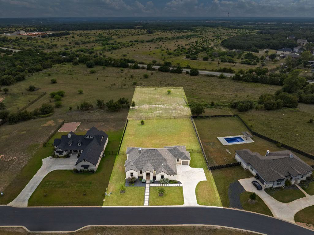 an aerial view of a house with a lake view