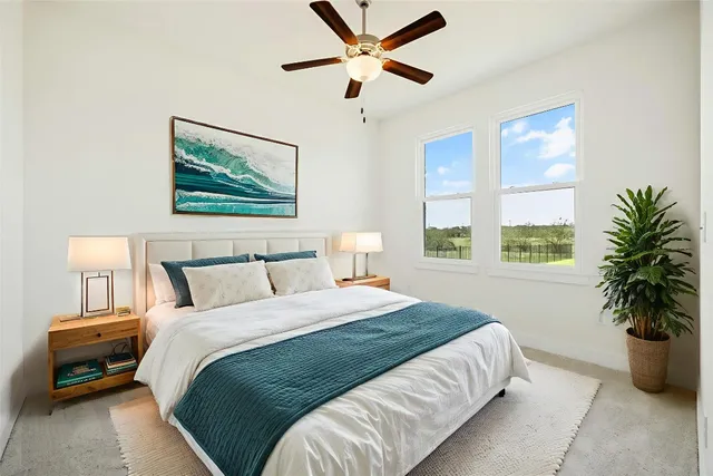 a bathroom with a shower sink mirror and toilet