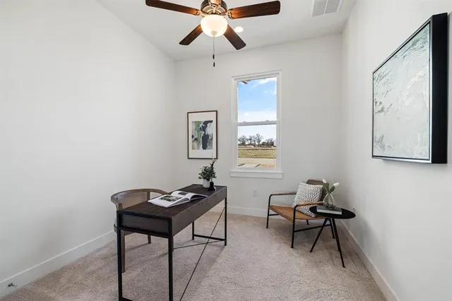 a bedroom with a bed and a potted plant