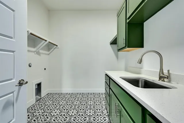 a view of a kitchen with a sink and dishwasher