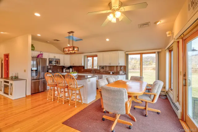a view of a dining room with furniture window and outside view