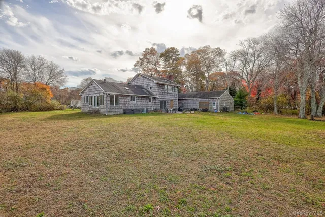 a view of a patio with a yard