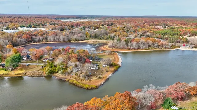 an aerial view of a city with ocean view