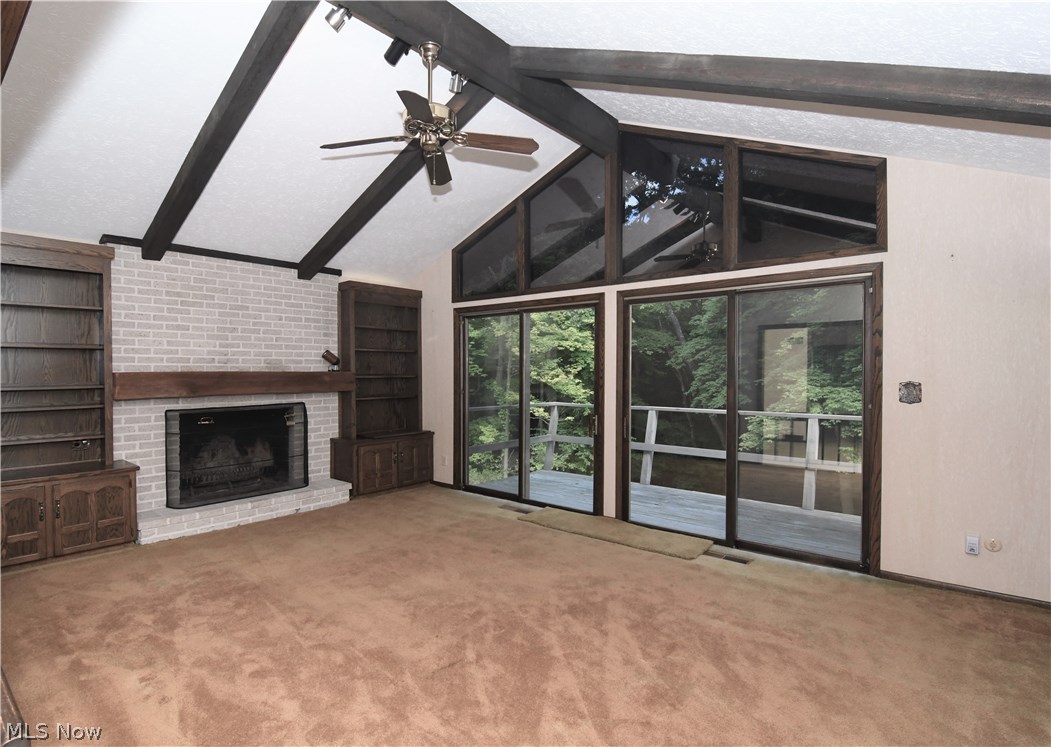 1271 Sand Run Road Akron, OH 44313 - Photo 10 of 32 Large Family is off the kitchen area with fireplace and built-ins sliders to balcony