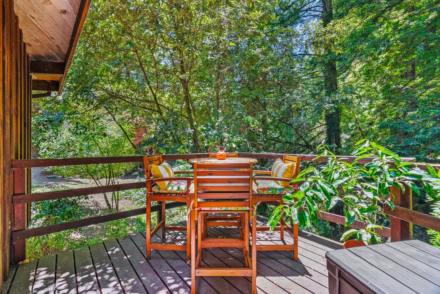 769 Cathedral Drive Aptos, CA 95003 - Photo 28 of 41 a view of a chairs and table in a wooden deck