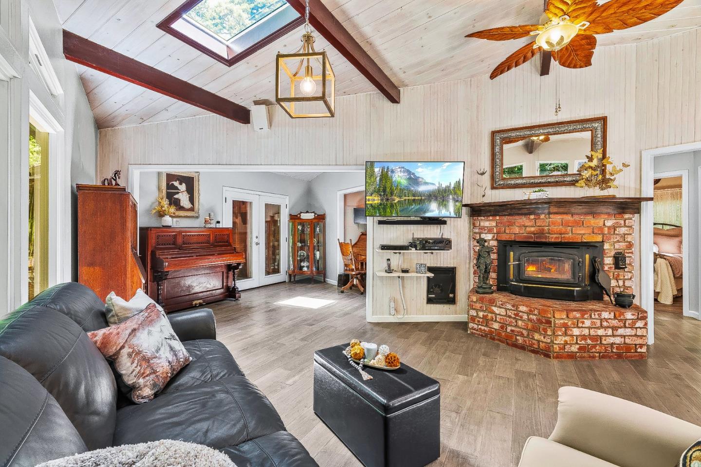 769 Cathedral Drive Aptos, CA 95003 - Photo 5 of 41 a living room with furniture a flat screen tv and a fireplace