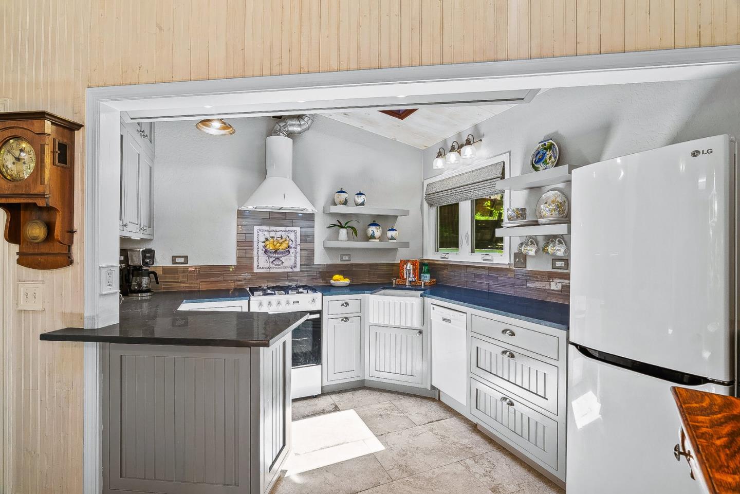 769 Cathedral Drive Aptos, CA 95003 - Photo 7 of 41 a kitchen with cabinets a sink and a stove