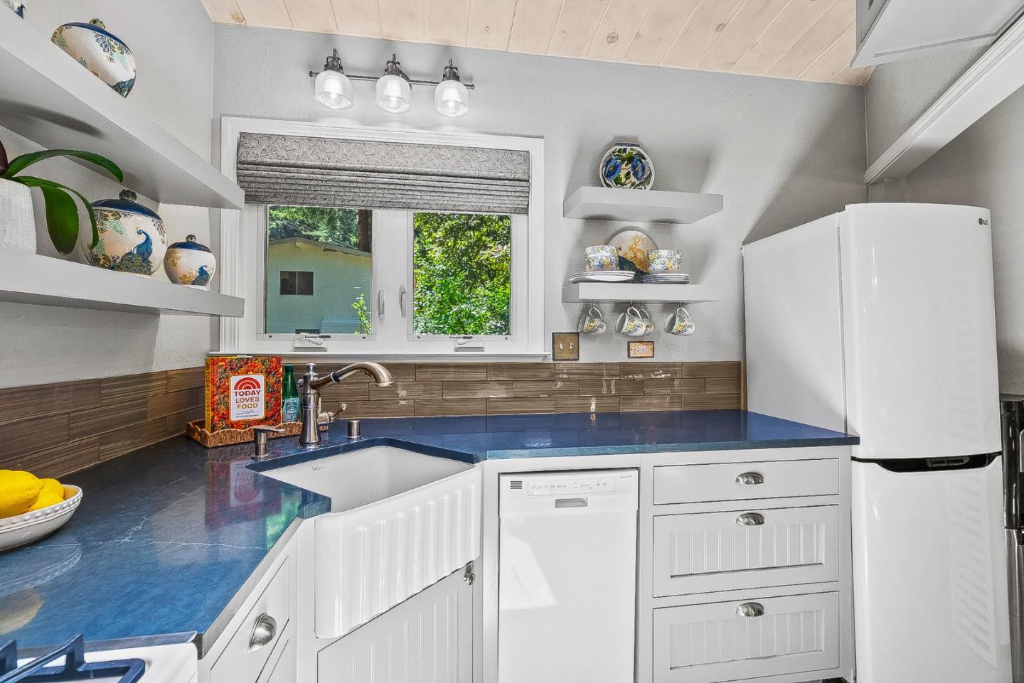 769 Cathedral Drive Aptos, CA 95003 - Photo 8 of 41 a kitchen with stainless steel appliances a refrigerator a sink a stove and a refrigerator