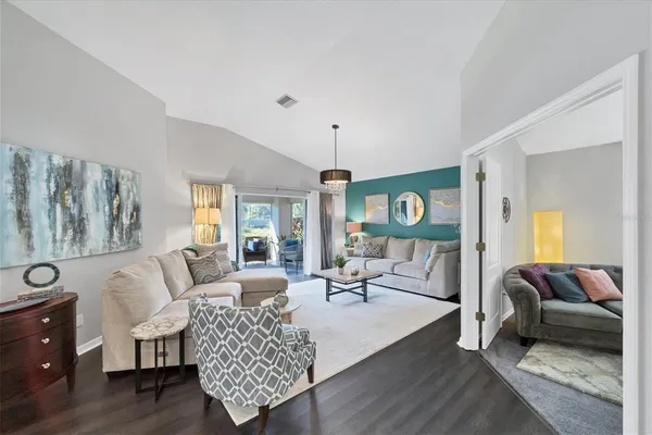 a living room with furniture and a large window