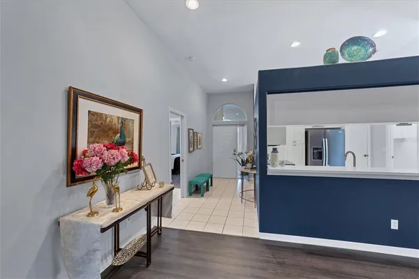 a living room with furniture and a potted plant