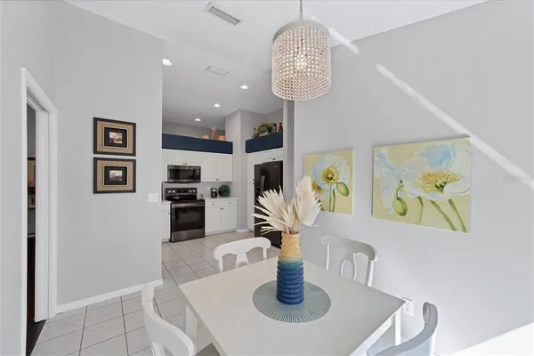 a kitchen with a table and chairs