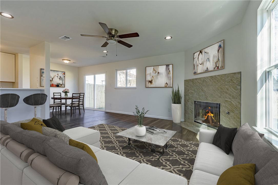 5000 Teri Road Austin, TX 78744 - Photo 1 of 1 a living room with furniture and a fireplace