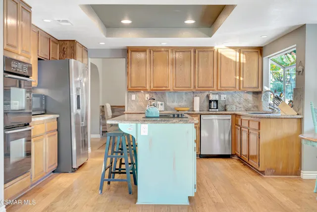 a dining room with furniture and a window