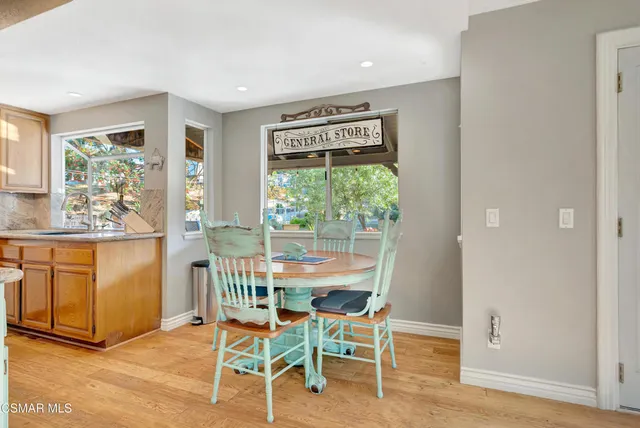 a living room with fireplace furniture and a floor to ceiling window