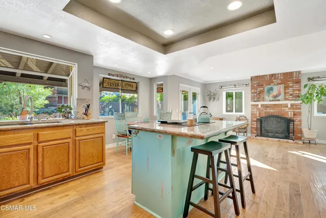 a view of a livingroom with furniture and a fireplace