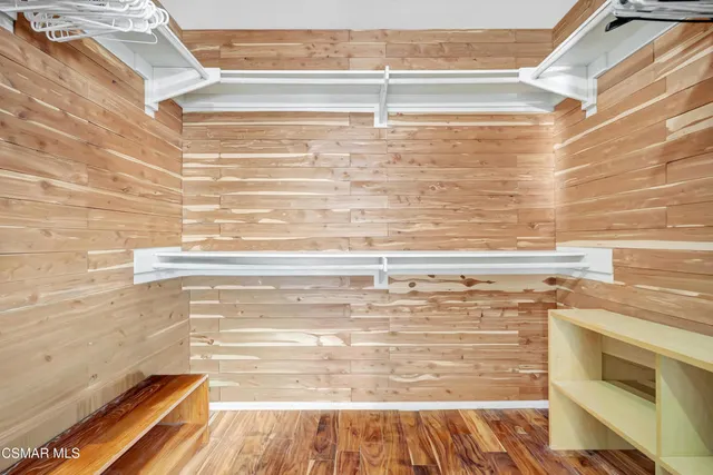 a bedroom with a bed and a table