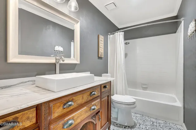 a view of a patio with table and chairs and potted plants
