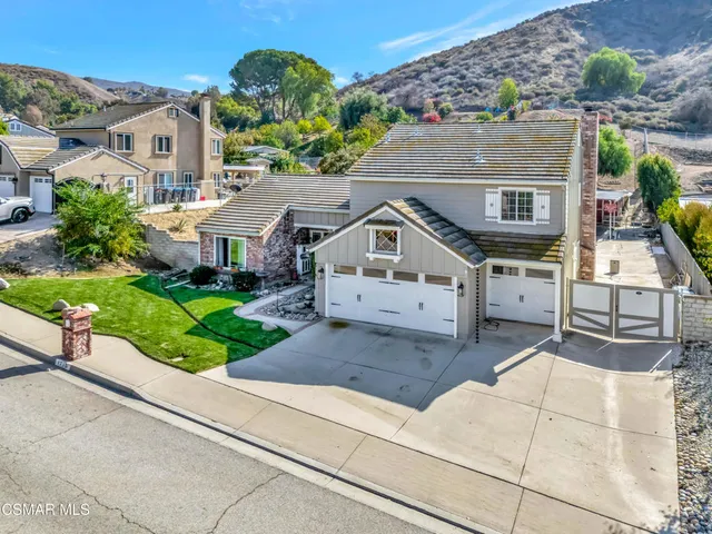 a aerial view of a house with a yard
