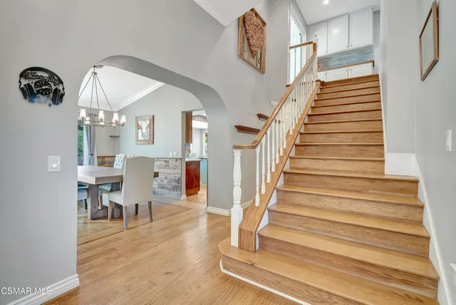 a living room with furniture and large window