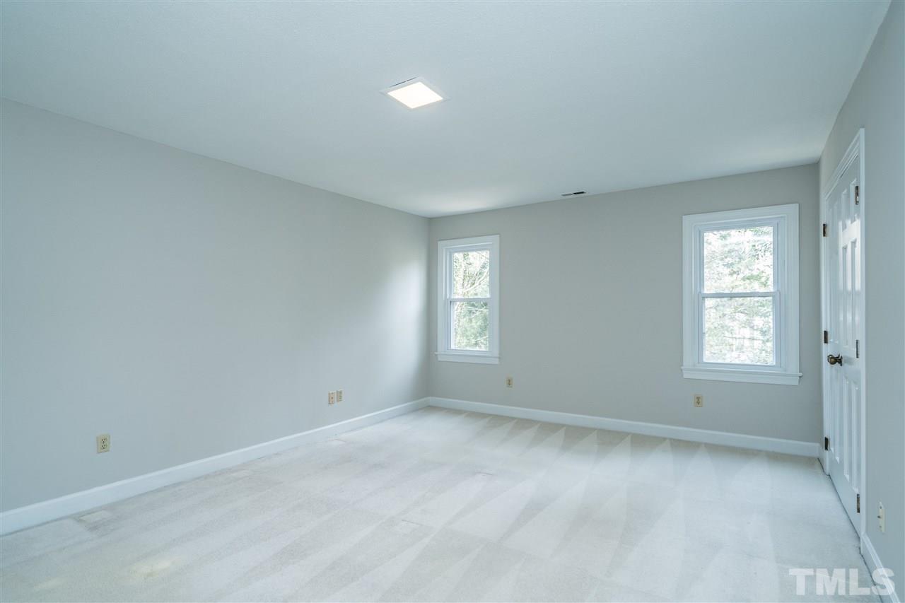 4516 Connell Drive Raleigh, NC 27612 - Photo 16 of 28 an empty room with windows
