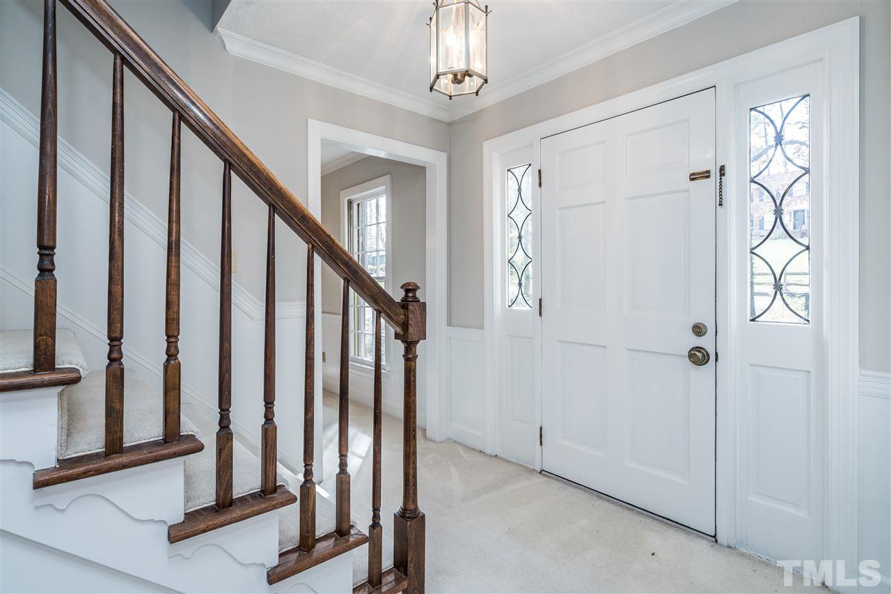 4516 Connell Drive Raleigh, NC 27612 - Photo 3 of 28 a view of an entryway with staircase