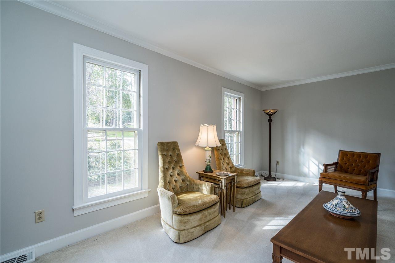 4516 Connell Drive Raleigh, NC 27612 - Photo 4 of 28 a living room with furniture and a window