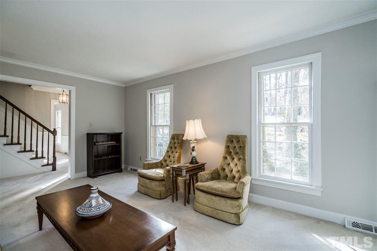 4516 Connell Drive Raleigh, NC 27612 - Photo 5 of 28 a living room with furniture and a window