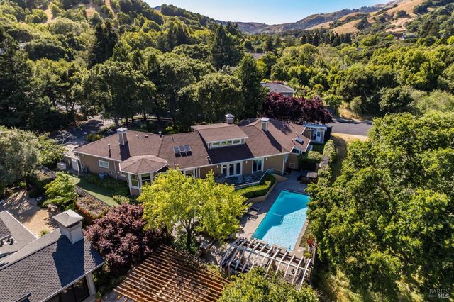 an aerial view of a house with a garden