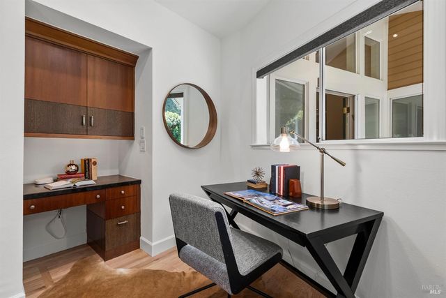 a kitchen with a table and chairs