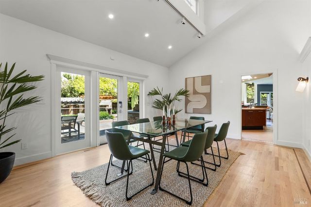 a large kitchen with stainless steel appliances kitchen island granite countertop a large counter top and sink