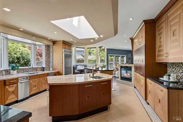 a view of a dining room with furniture and a large window