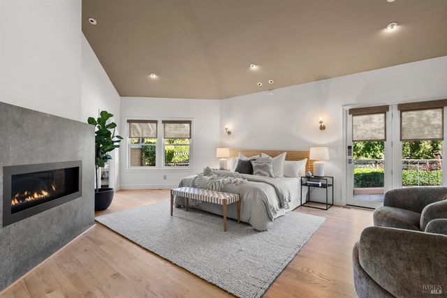 a bedroom with a bed a desk and chair