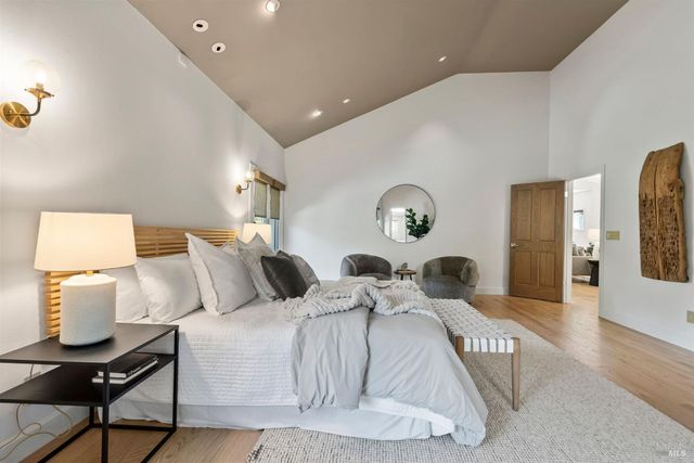 a bedroom with bed and a window