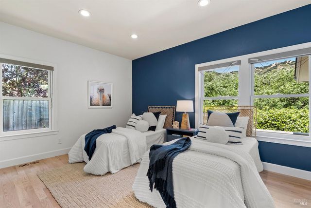 a kitchen with a stove a sink and a microwave