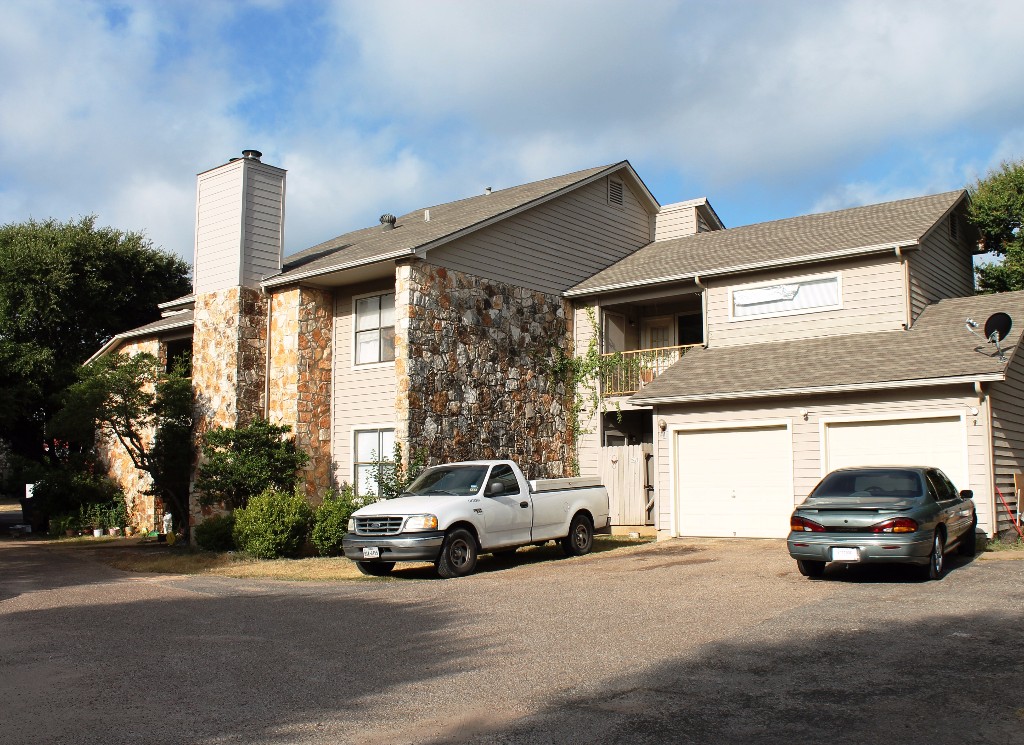 8804 Schick Road Austin, TX 78729 - Photo 1 of 1 a car parked in front of a house