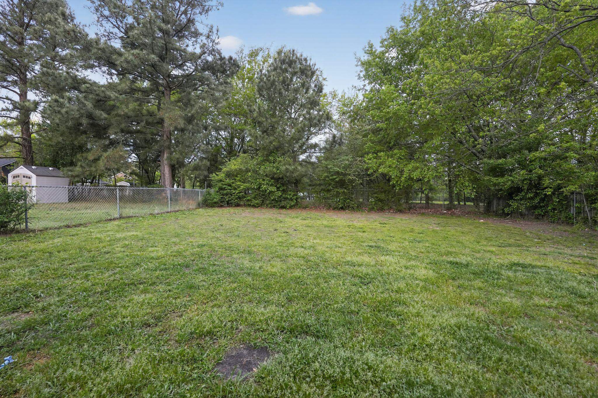 4725 Lofts Road Memphis, TN 38118 - Photo 27 of 32 a view of outdoor space with deck and yard