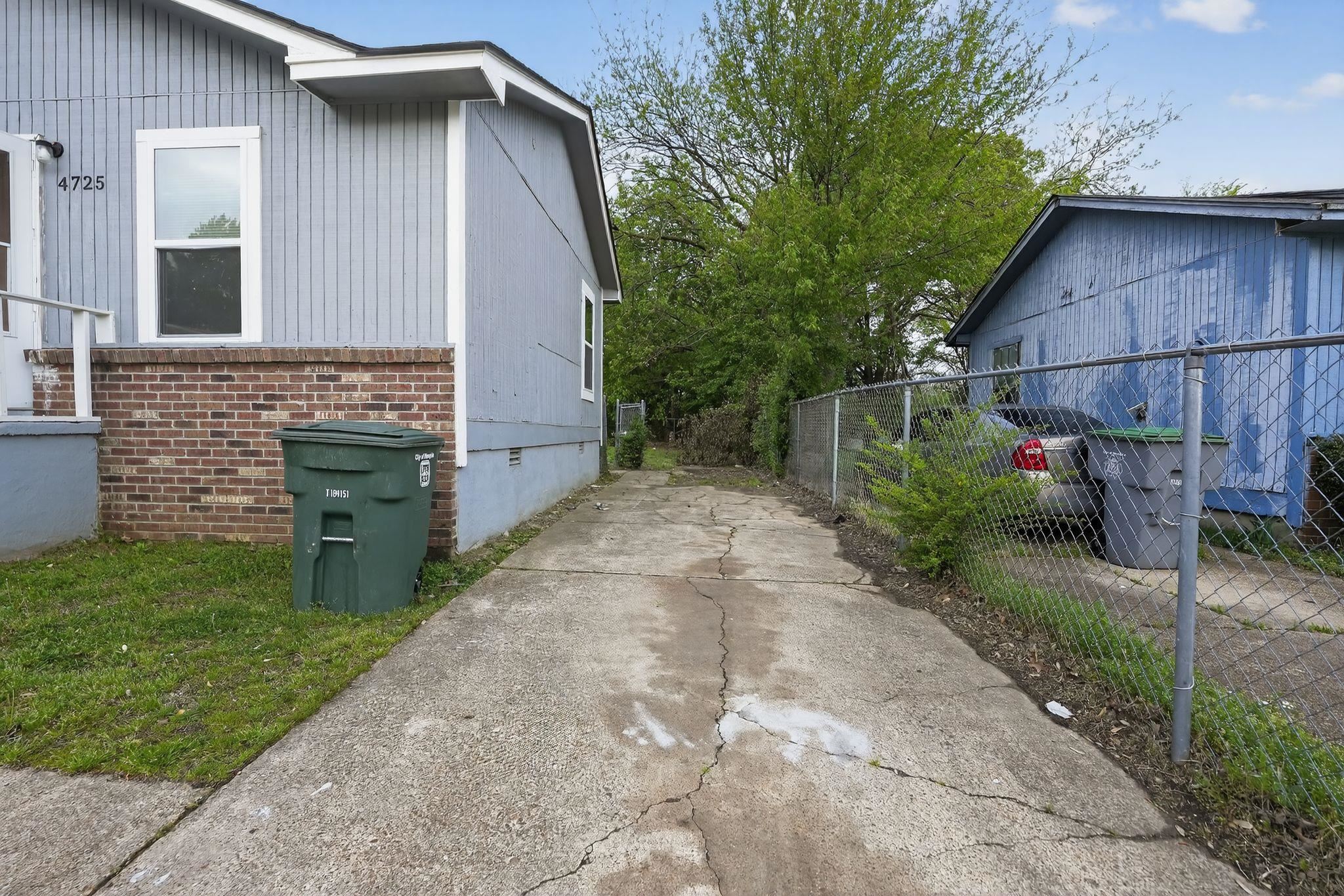 4725 Lofts Road Memphis, TN 38118 - Photo 5 of 32 a backyard of a house with plants and barbeque oven