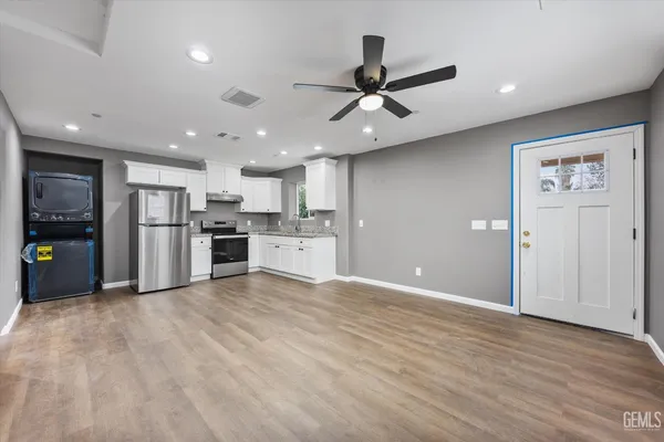 a view of kitchen with stainless steel appliances refrigerator oven and stove