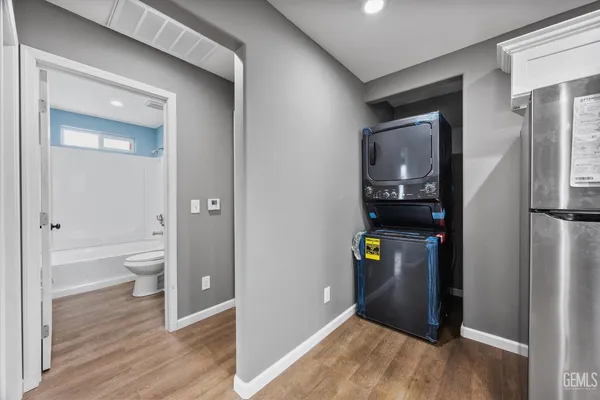a view of an entryway of house and wooden floor