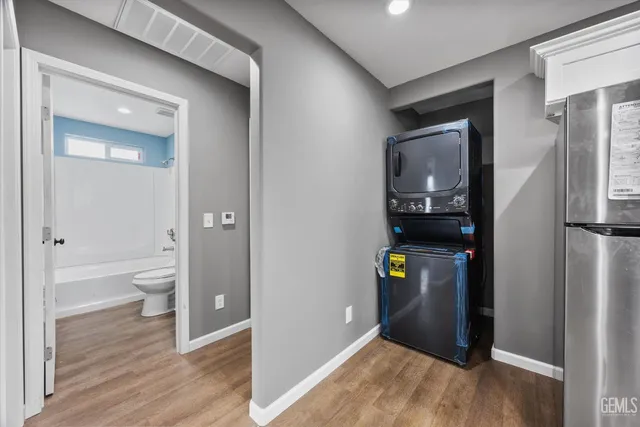 a view of an entryway of house and wooden floor