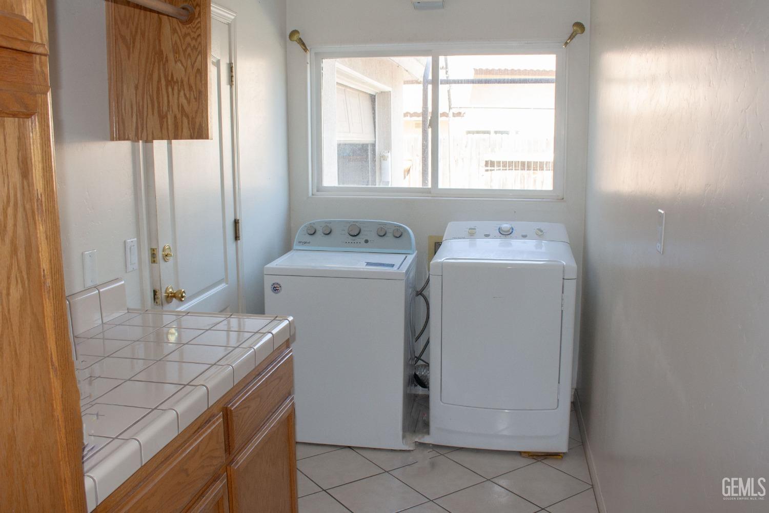 Undisclosed Address Bakersfield, CA 93313 - Photo 14 of 17 a utility room with dryer and washer