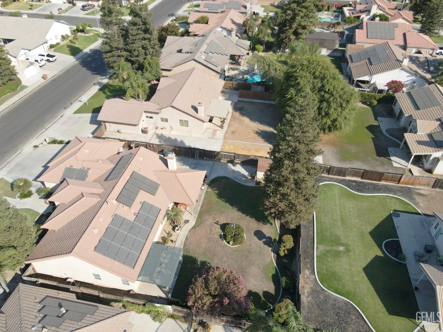 Undisclosed Address Bakersfield, CA 93313 - Photo 15 of 17 an aerial view of residential house with outdoor space and parking