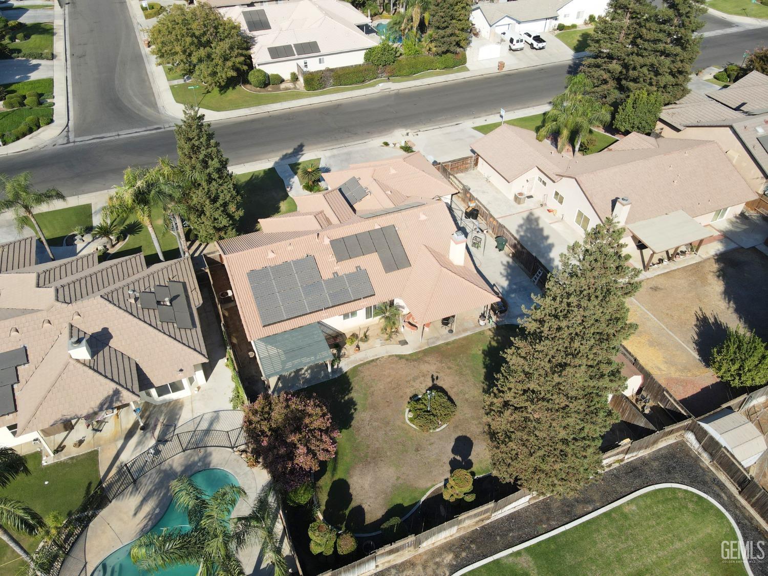 Undisclosed Address Bakersfield, CA 93313 - Photo 16 of 17 an aerial view of a house with a yard and lake view