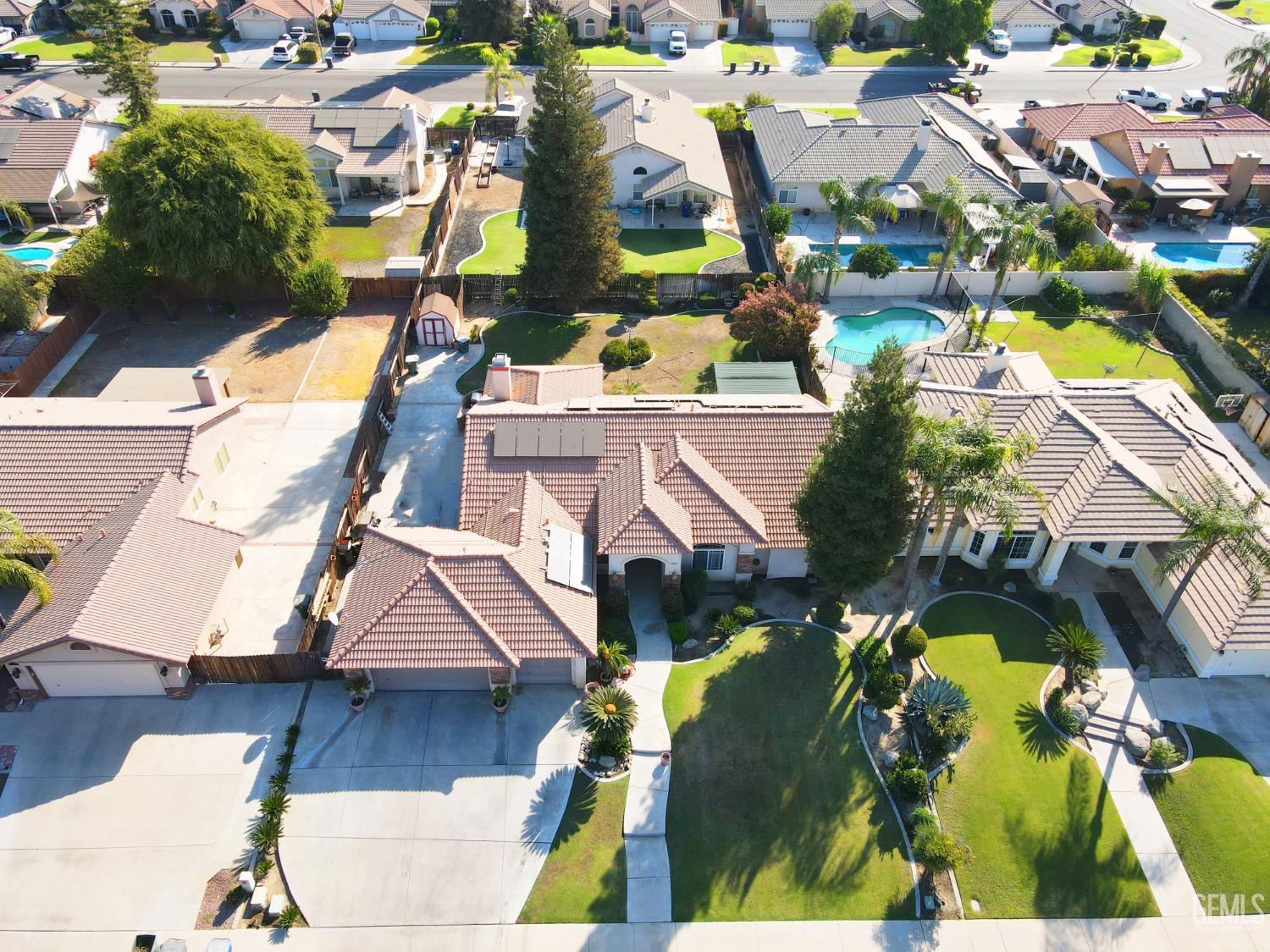 Undisclosed Address Bakersfield, CA 93313 - Photo 3 of 17 an aerial view of residential houses with outdoor space and swimming pool