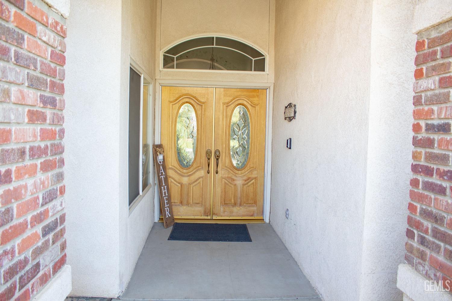 Undisclosed Address Bakersfield, CA 93313 - Photo 4 of 17 a view of front door of house