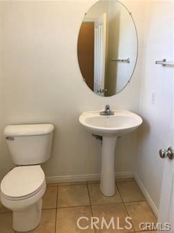 4473 Bigem Court Riverside, CA 92501 - Photo 6 of 20 a bathroom with a toilet sink and mirror