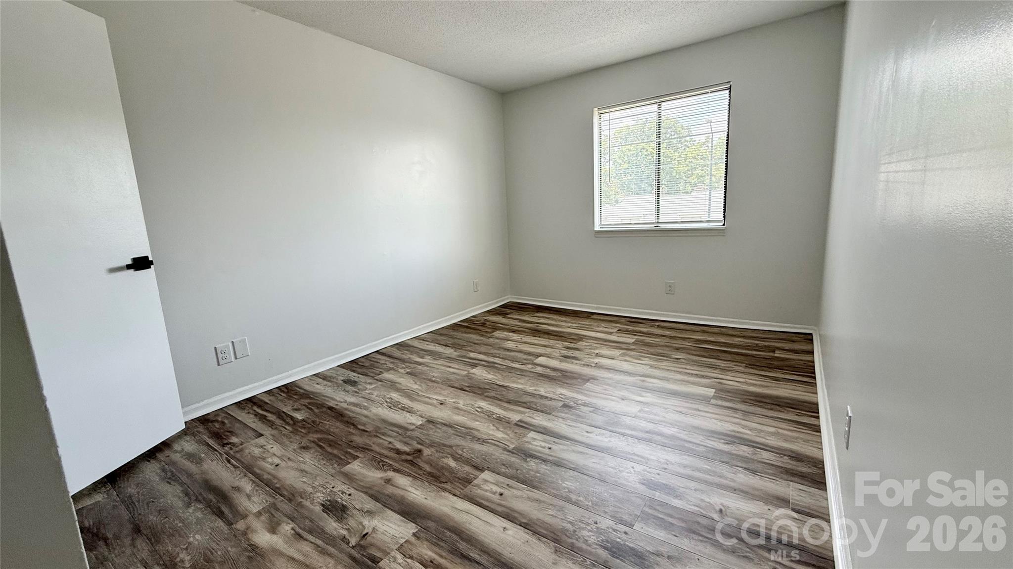 11023 Harrowfield Road Charlotte, NC 28226 - Photo 24 of 32 wooden floor in an empty room