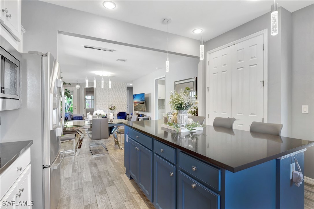 10908 Clarendon Street Fort Myers, FL 33913 - Photo 15 of 49 a kitchen with sink cabinets and living room