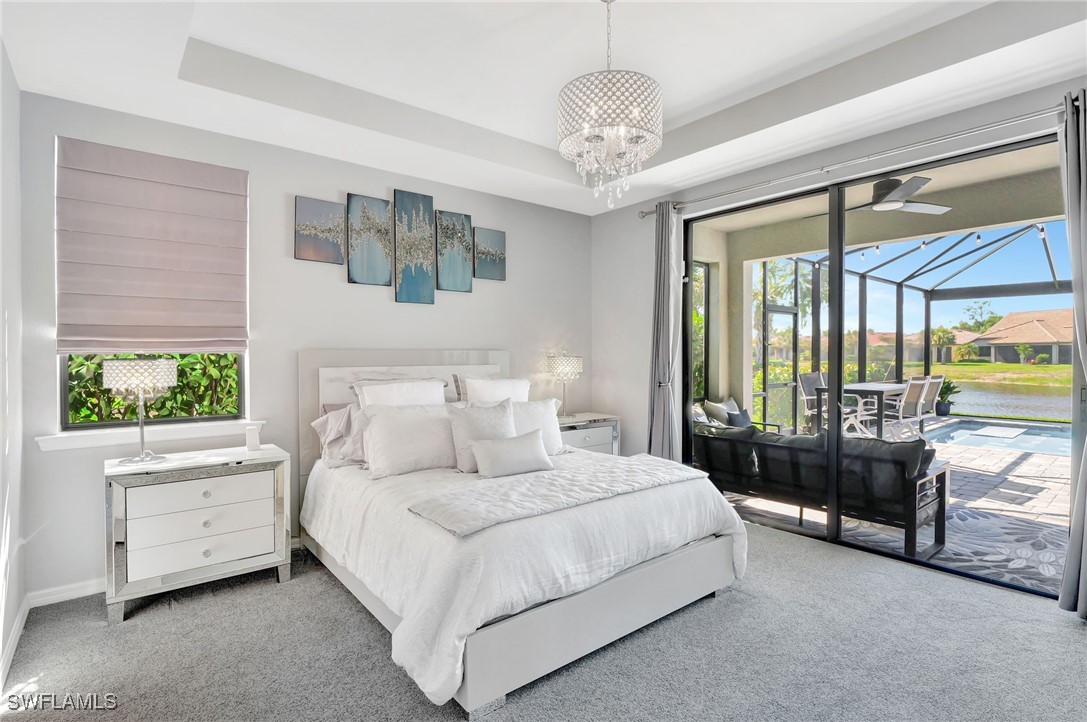 10908 Clarendon Street Fort Myers, FL 33913 - Photo 16 of 49 a bedroom with bed and a large window