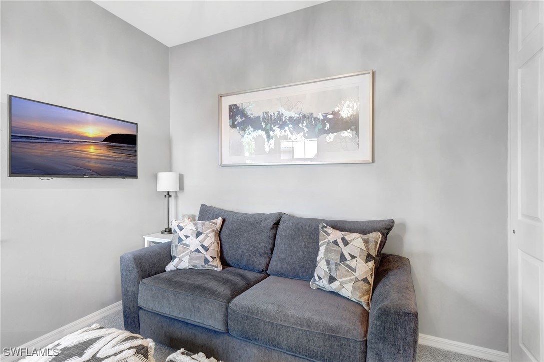 10908 Clarendon Street Fort Myers, FL 33913 - Photo 26 of 49 a living room with furniture and a view of kitchen